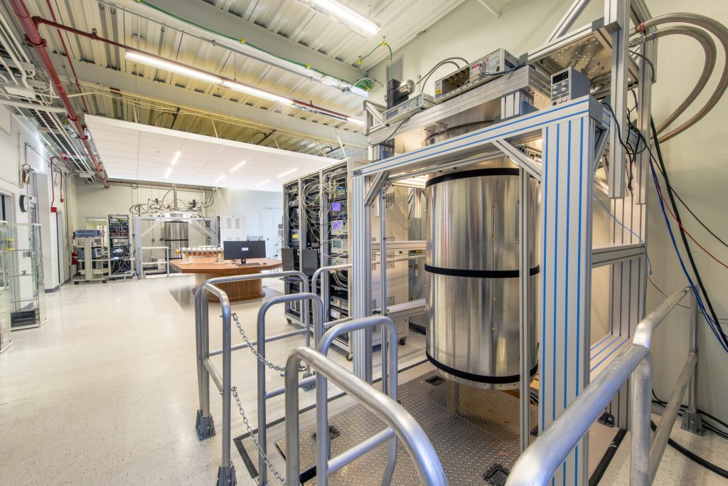 Seen in QCL-1 at Fermilab is dilution refrigerator #2 at the forefront. A table with a nine-cell SRF cavity with dilution refrigerator #1 are in the background. 